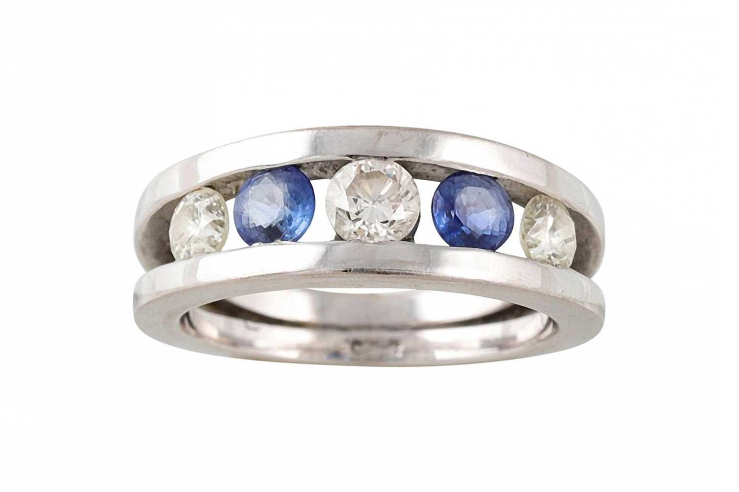 Lot 187 - A SAPPHIRE AND DIAMOND FIVE STONE RING, the...