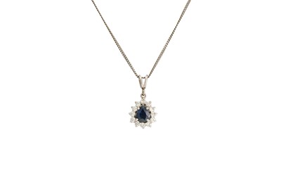 Lot 415 - A PEAR SHAPED DIAMOND AND SAPPHIRE DROP...