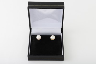 Lot 293 - A PAIR OF CULTURED PEARL EARRINGS, mounted in...