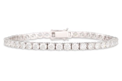 Lot 328 - A DIAMOND LINE BRACELET, the round brilliant...