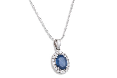 Lot 190 - A SAPPHIRE AND DIAMOND PENDANT, the oval...