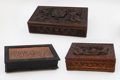 Lot 230 - A COLLECTION OF CARVED WOODEN BOXES, depicting...