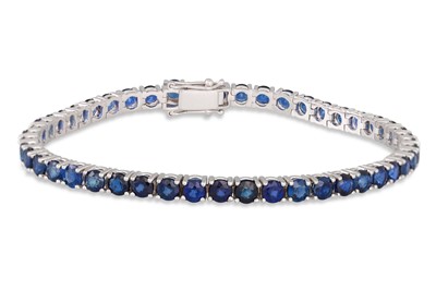 Lot 290 - A SAPPHIRE LINE BRACELET, the circular stones...