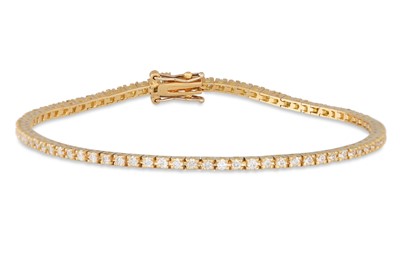 Lot 325 - A DIAMOND LINE BRACELET, the brilliant cut...