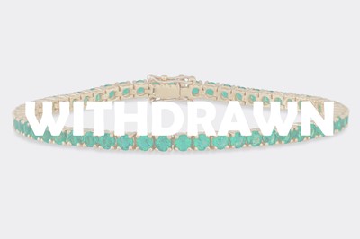 Lot 326 - AN EMERALD LINE BRACELET, the circular stones...