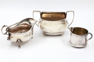 Lot 253 - A HELMET SHAPED SILVER SAUCE BOAT, together...