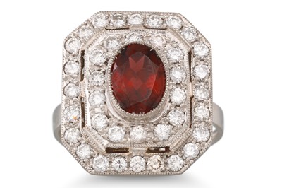 Lot 154 - A GARNET AND DIAMOND PLAQUE RING, the oval...