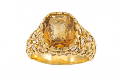 Lot 438 - A CITRINE AND DIAMOND RING, the oval citrine...