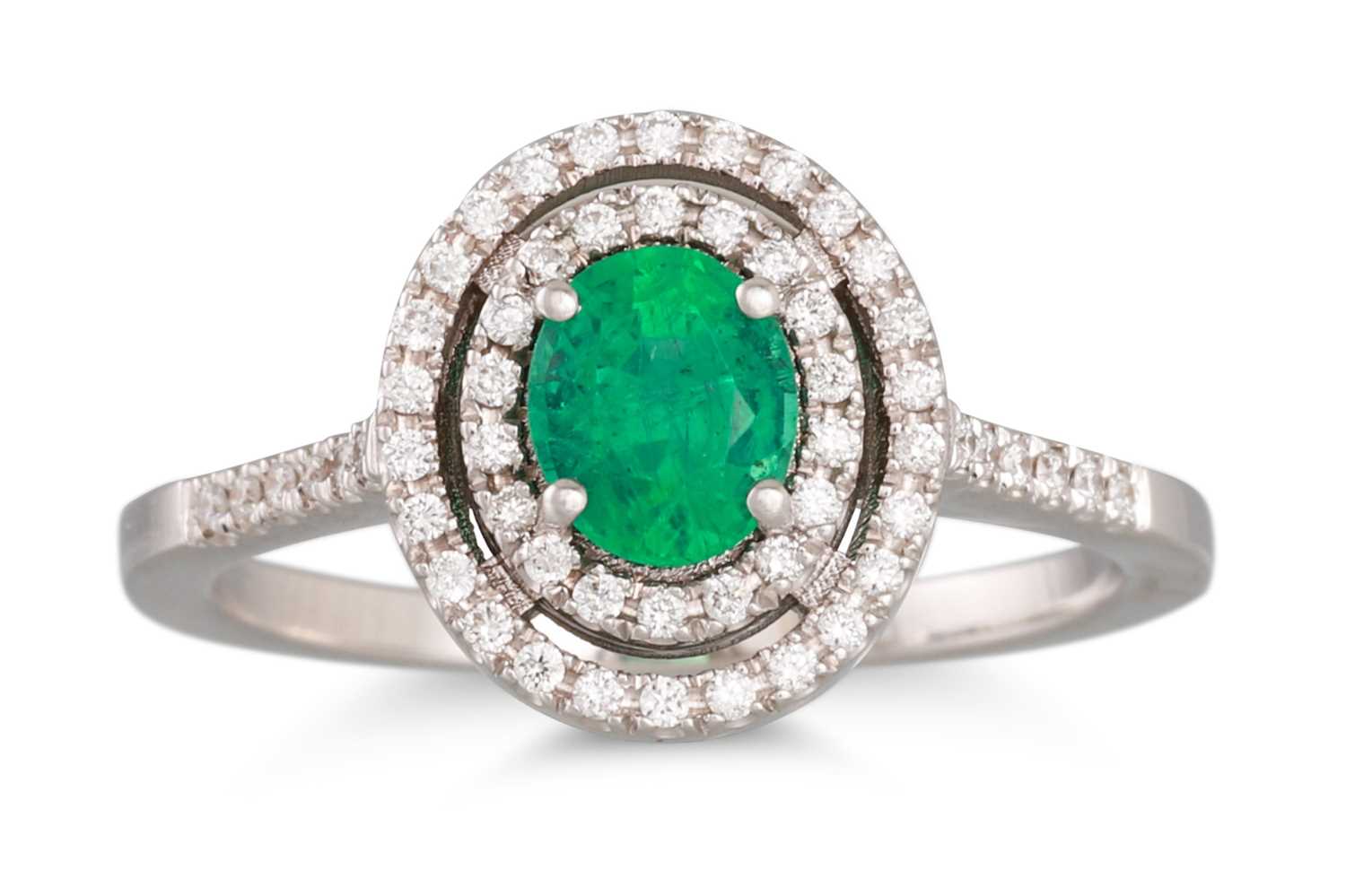 Lot 114 - AN EMERALD AND DIAMOND CLUSTER RING, the oval...