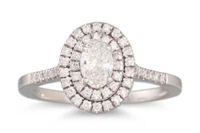 Lot 300 - A DIAMOND CLUSTER RING, the oval diamond to a...