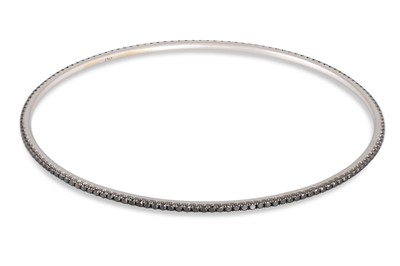 Lot 303 - A BLACK DIAMOND BANGLE, in 18ct white gold....