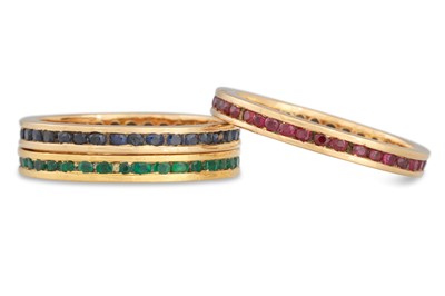 Lot 125 - A SET OF THREE GOLD RINGS, set with emerald,...