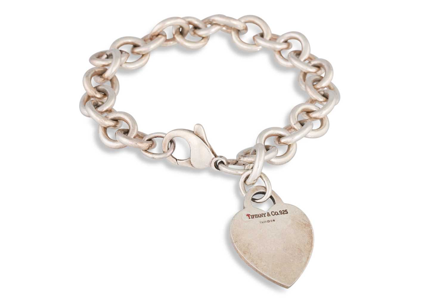 Lot 78 - A SILVER BRACELET, with Tiffany heart charm