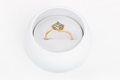 Lot 22 - A GEMSTONE DRESS RING, mounted in 9ct yellow...