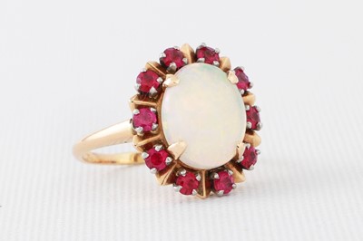 Lot 11 - AN OPAL AND SYNTHETIC RED STONE CLUSTER RING,...
