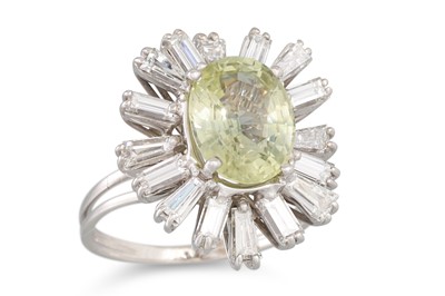 Lot 235 - A YELLOW SAPPHIRE AND DIAMOND CLUSTER RING,...