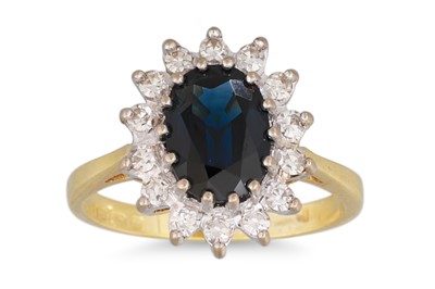 Lot 13 - A SAPPHIRE AND DIAMOND CLUSTER RING, the oval...