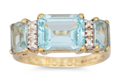 Lot 35 - A DIAMOND AND TOPAZ RING, the emerald cut...