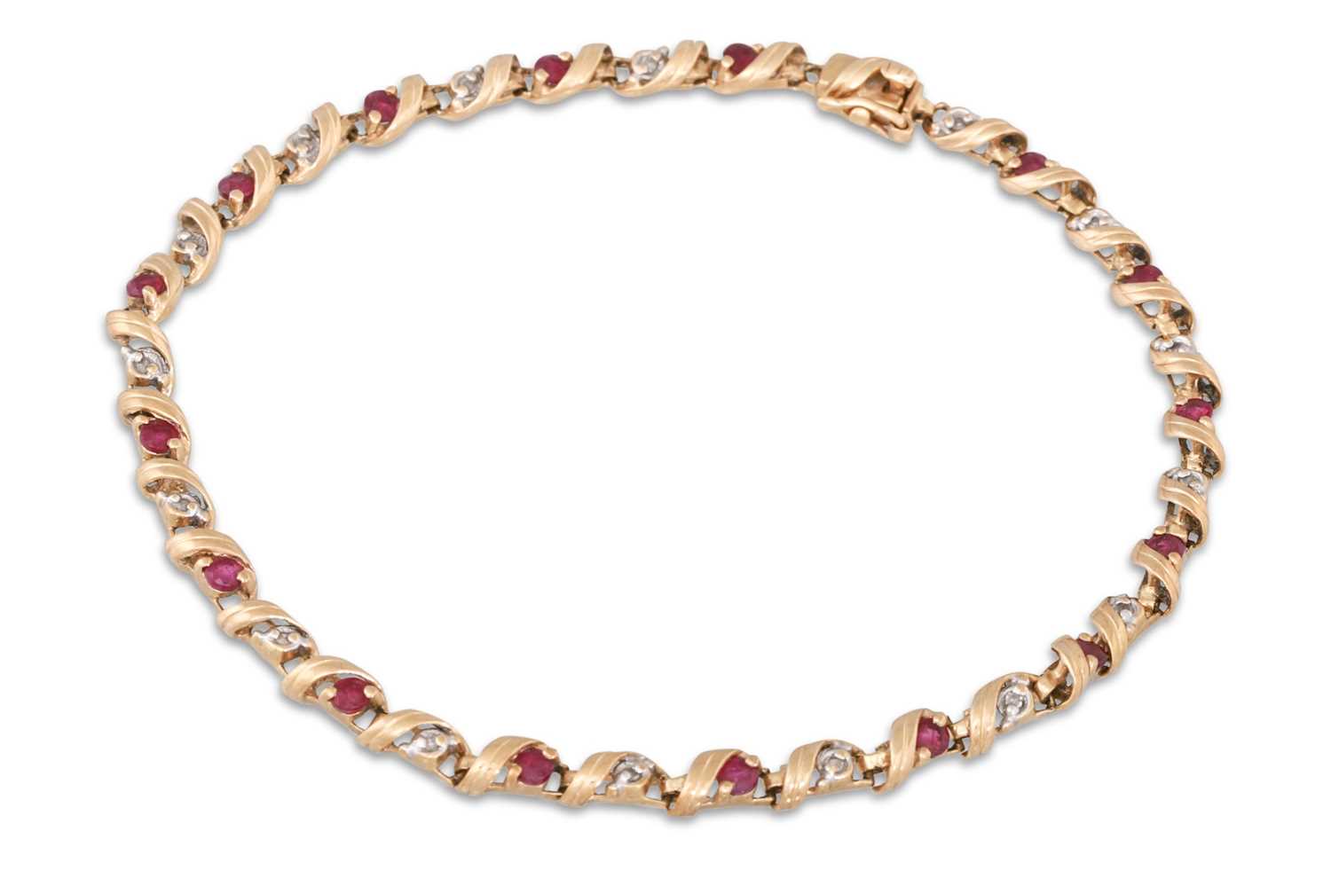 Lot 243 - A DIAMOND AND RUBY BRACELET, mounted in yellow...