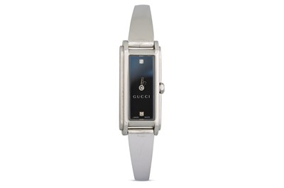 Lot 384 - A LADY'S GUCCI WRISTWATCH, black face horsebit...