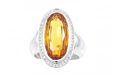 Lot 347 - A CITRINE AND DIAMOND CLUSTER RING, the oval...