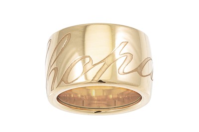 Lot 350 - A CHOPARD RING, the wide 18ct gold band...