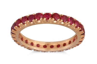 Lot 251 - A RUBY FULL BANDED ETERNITY RING, mounted in...