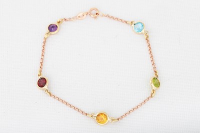 Lot 139 - A CITRINE AND AMETHYST BRACELET, gold mounts