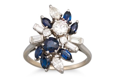Lot 75 - A DIAMOND AND SAPPHIRE CLUSTER RING, mounted...