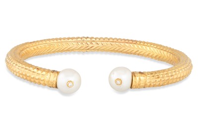 Lot 85 - AN INDIAN 22 CT GOLD BANGLE, pearl and diamond...