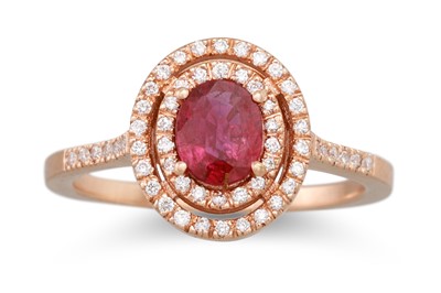 Lot 154 - A RUBY AND DIAMOND CLUSTER RING, oval halo...