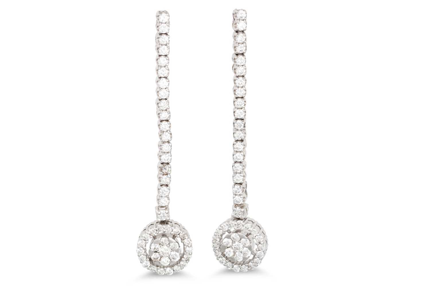 Lot 282 - A PAIR OF DIAMOND DROP CLUSTER EARRINGS, the...