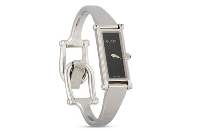 Lot 410 - A LADY'S STAINLESS STEEL "GUCCI" WRISTWATCH,...