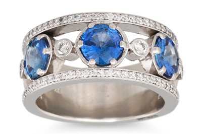 Lot 337 - A SAPPHIRE AND DIAMOND BAND RING, the circular...