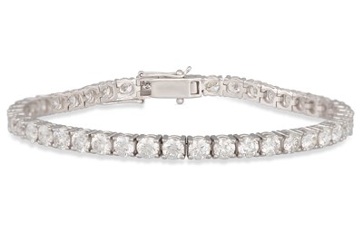 Lot 213 - A DIAMOND LINE BRACELET, the brilliant cut...