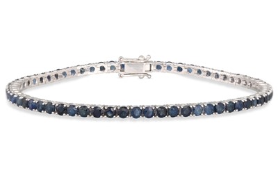 Lot 215 - A SAPPHIRE LINE BRACELET, the circular...