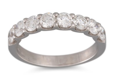 Lot 223 - A DIAMOND HALF ETERNITY RING, the brilliant...