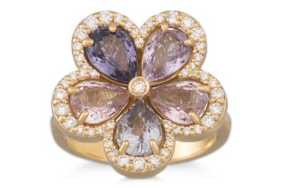 Lot 266 - A DIAMOND AND SAPPHIRE CLUSTER RING, of floral...