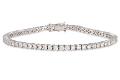 Lot 273 - A DIAMOND LINE BRACELET, the brilliant cut...