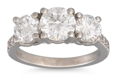 Lot 205 - A DIAMOND THREE STONE RING, the graduated...