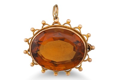 Lot 21 - A TOPAZ PENDANT, mounted in gold