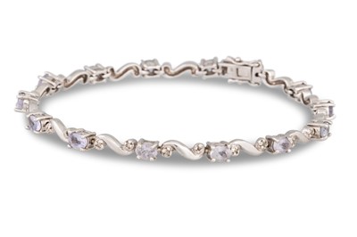 Lot 137 - A DIAMOND AND GEM SET BRACELET, in white gold