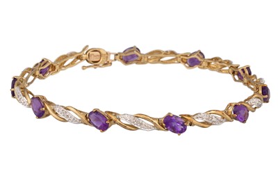 Lot 148 - A DIAMOND AND AMETHYST BRACELET, mounted in...