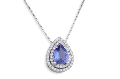 Lot 243 - A TANZANITE AND DIAMOND PENDANT, the pear...