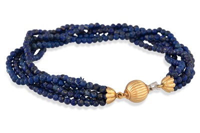 Lot 244 - A BEADED MULTI STRANDED LAPIS LAZULI BRACELET,...