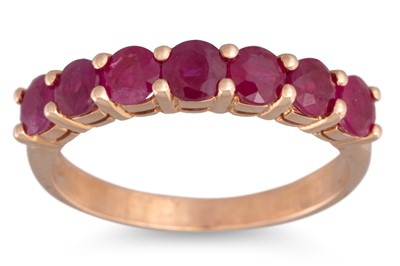 Lot 288 - A RUBY SEVEN STONE RING, mounted in 18ct gold....