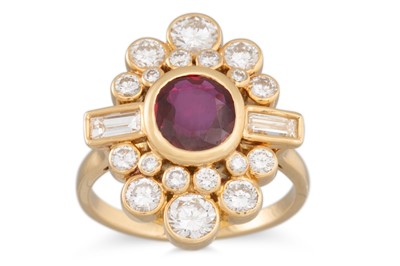 Lot 210 - A DIAMOND AND RUBY CLUSTER RING, the circular...