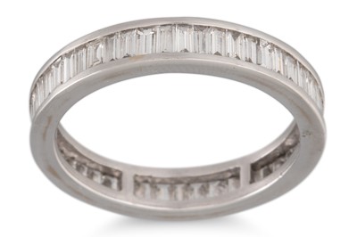 Lot 211 - A DIAMOND ETERNITY RING, the baguette cut...