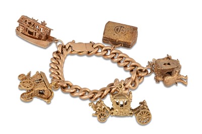 Lot 131 - A HEAVY 9CT GOLD CHARM BRACELET, suspending 5...