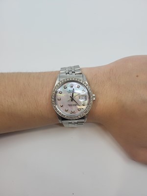Lot 410 - A MIDSIZE STAINLESS STEEL ROLEX OYSTER...